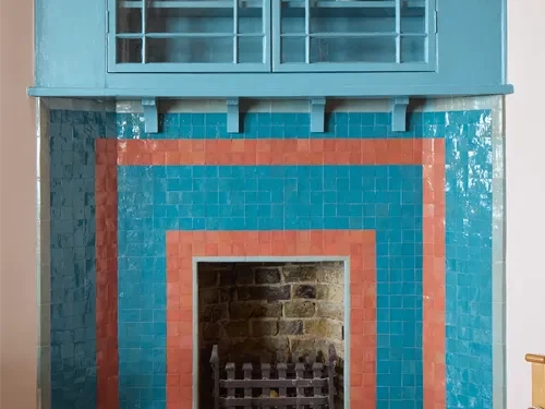 Blue and orange fireplace with small zellige tiles copy